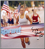 Sprint finish line with woman in white shirt